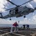 Sailors prepare to conduct a helicopter in-flight refueling (HIFI)