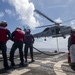 Sailors conduct a helicopter in-flight refueling (HIFI)