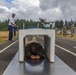 Staff Sgt. Devin Crawford slides through an obstacle