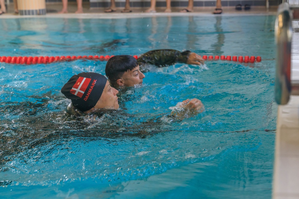 Capt. Mille Hewalo and Maj. Nicole Dallocchio finish the water obstacle course