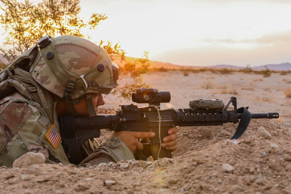 A Soldier with Charlie Company 1-185th Infantry Regiment, California Army National Guard, aims down his sight during a live-fire exercise at the National Training Center in Fort Irwin, California, July 30, 2021.