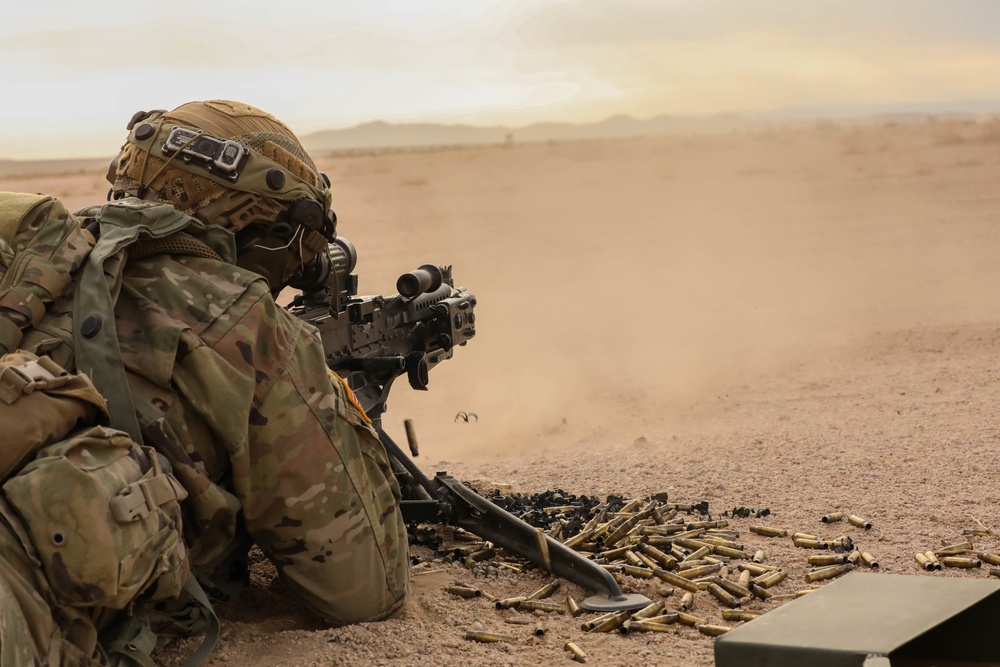 A Soldier with the Charlie Company 1-185th Infantry Regiment, California Army National Guard, aims down his sights during a live-fire exercise at the National Training Center in Fort Irwin, California, July 30, 2021.