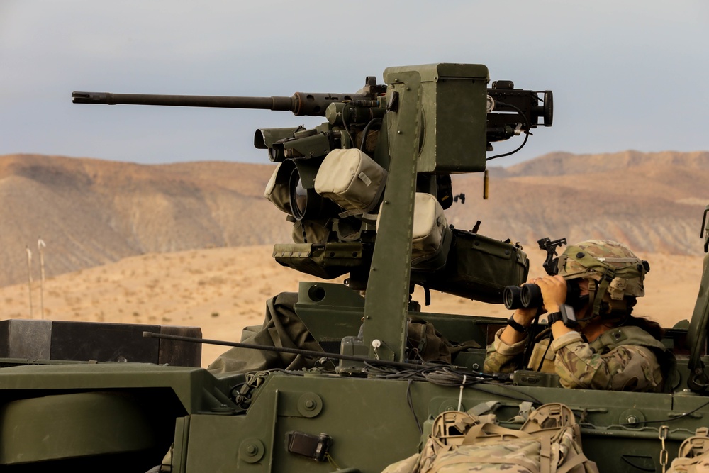 A Soldier with Charlie Company 1-185th Infantry Regiment, California Army National Guard, waits for targets in the Infantry Carrier Vehicle during a live-fire exercise at the National Training Center in Fort Irwin, California, July 30, 2021.