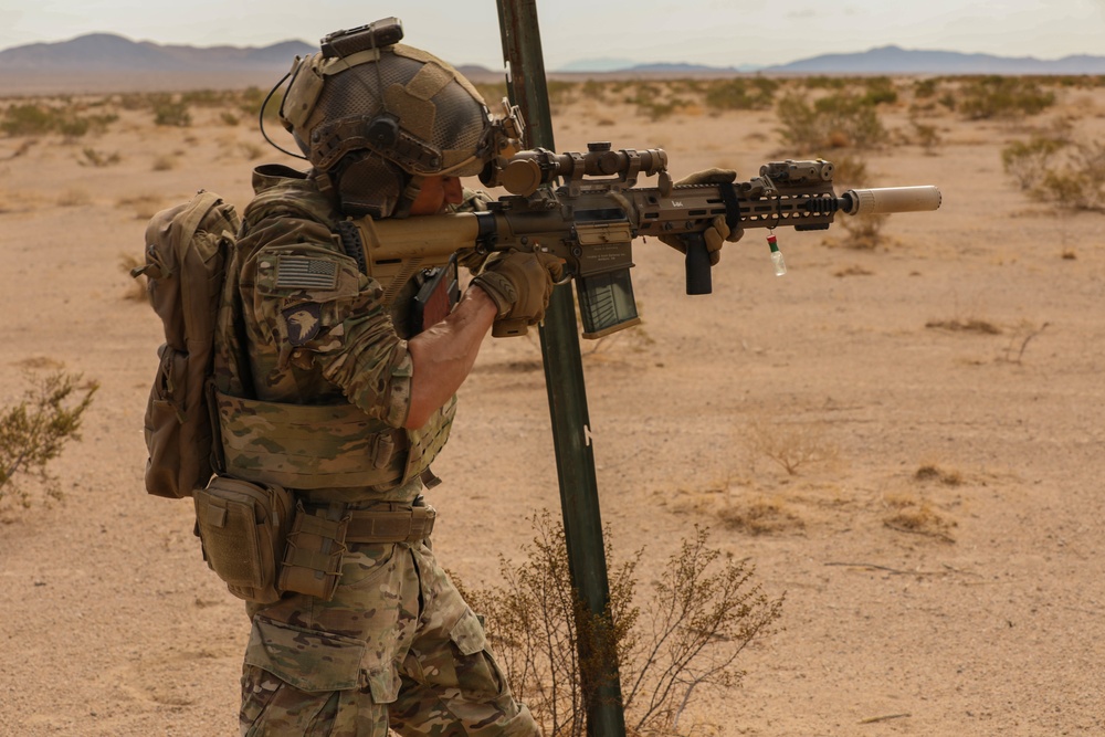 A Soldier with Charlie Company 1-185th Infantry Regiment, California Army National Guard, aims his sights during a live-fire exercise at the National Training Center in Fort Irwin, California, July 30, 2021.