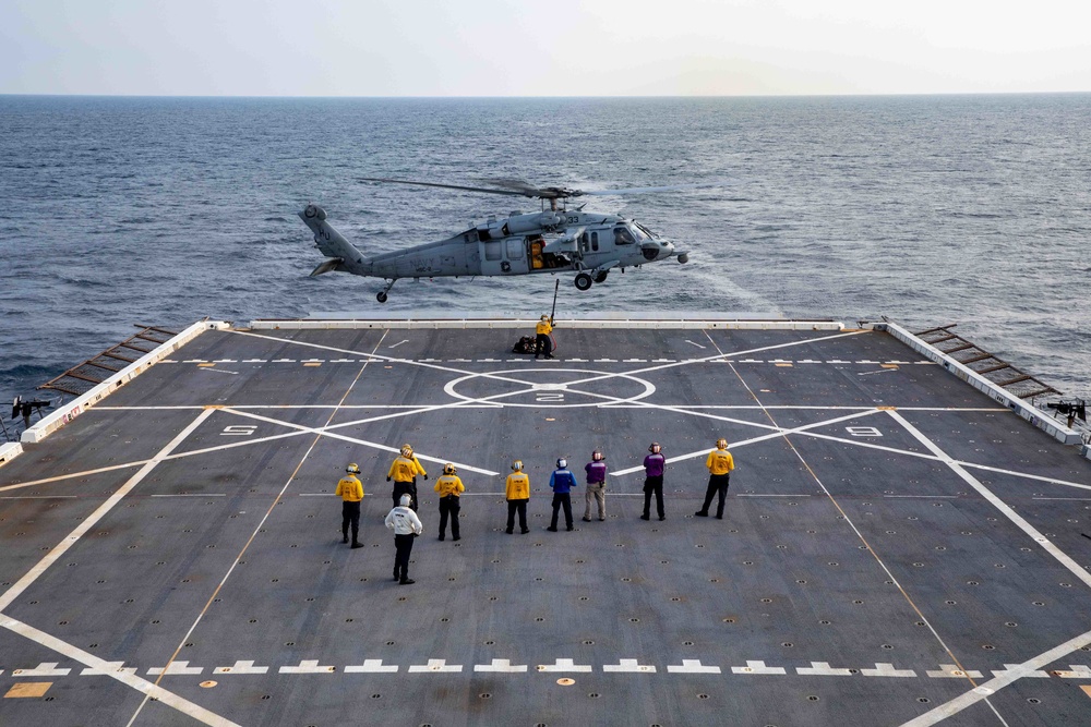 Arlington conducts flight operations with Helicopter Sea Combat Squadron (HSC) 2