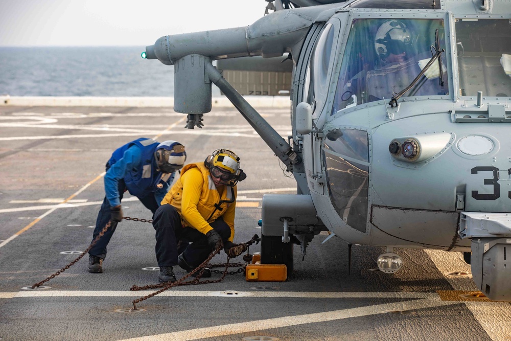 Arlington conducts flight operations with Helicopter Sea Combat Squadron (HSC) 2