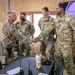 Col. Desormeaux presents coins to troops