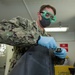 Aviation Boatswain’s Mate (Fuels) Tests Fuel Sample