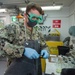 Aviation Boatswain’s Mate (Fuels) Tests Fuel Sample