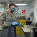 Aviation Boatswain’s Mate (Fuels) Tests Fuel Sample