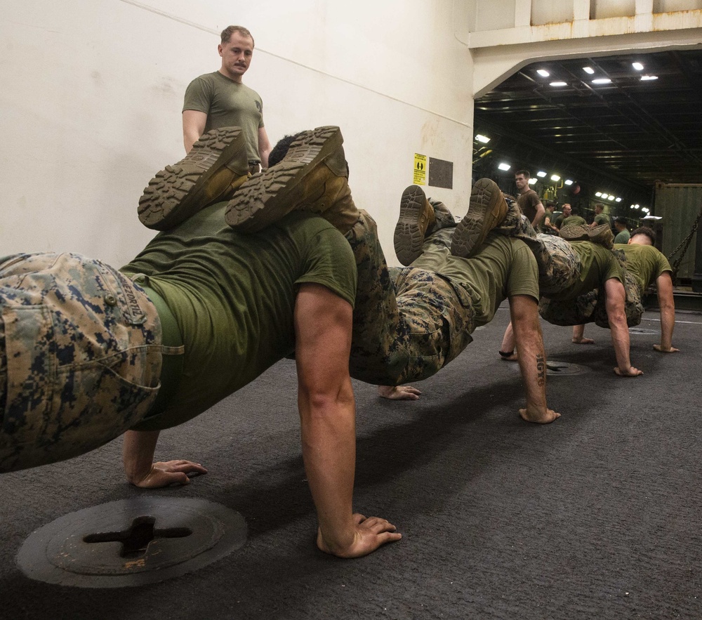 U.S. Marines with the 31st MEU conduct Squad PT during Corporals Course