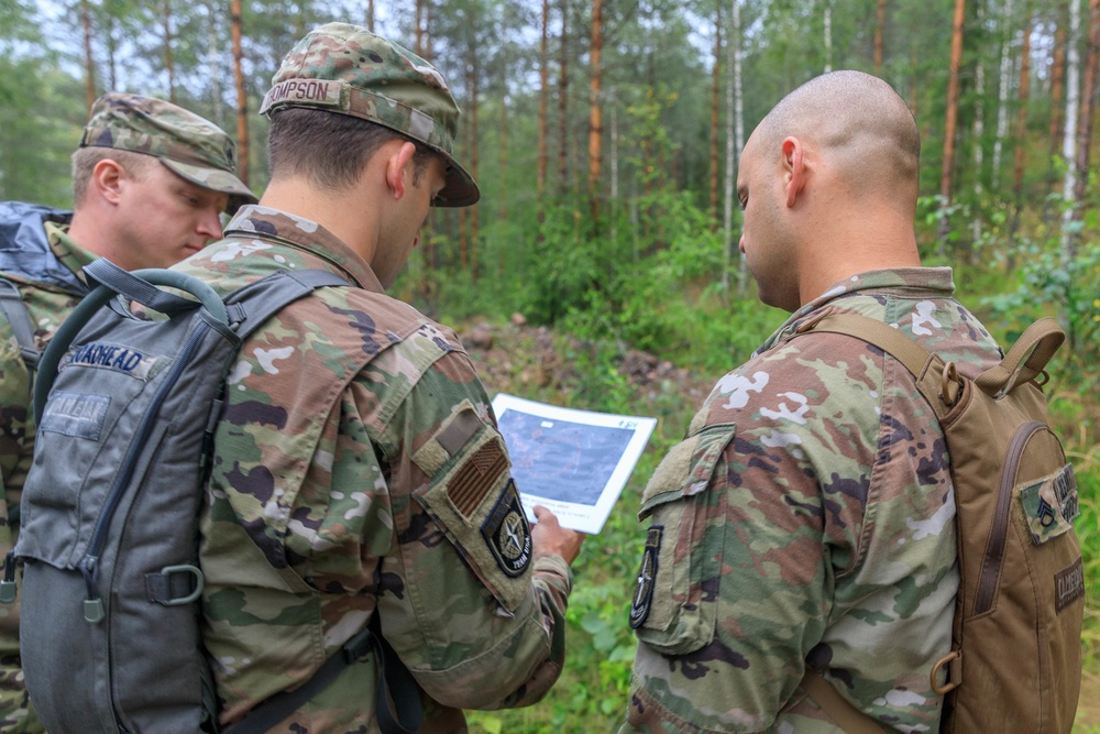 A team representing the United States of America, consults their map