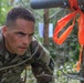 1st Lt. Joshua Moeller looks at a target in order to estimate distance