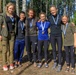 Female competitors pose with their medals