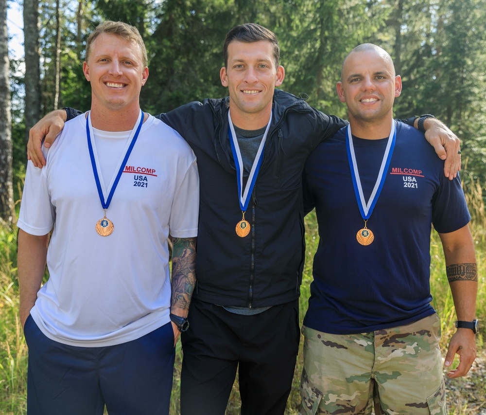 Sgt. 1st Class Shane Price, Staff Sgt. Trevor Thompson and Staff Sgt. Devin Crawford pose with their third place team medals