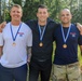 Sgt. 1st Class Shane Price, Staff Sgt. Trevor Thompson and Staff Sgt. Devin Crawford pose with their third place team medals