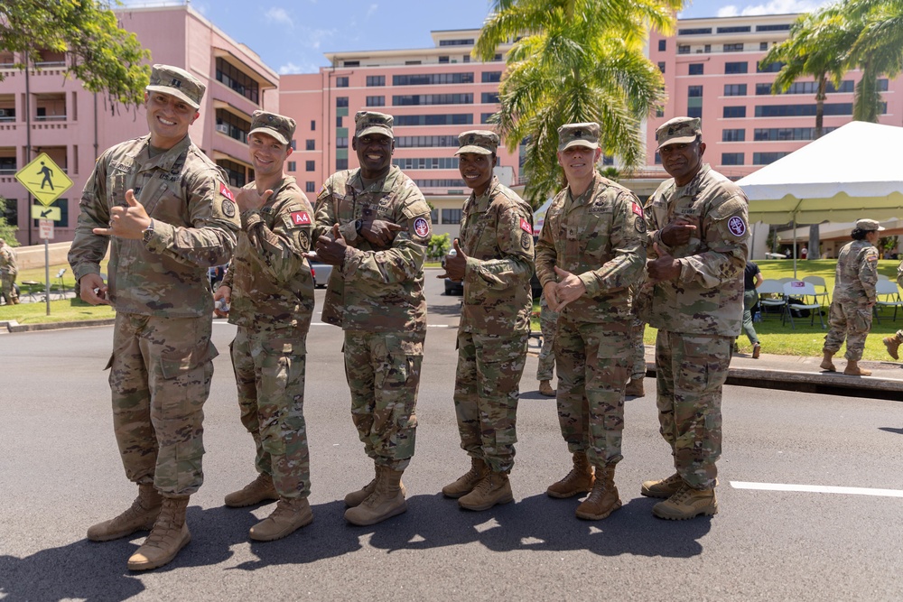 Lt. Gen. R. Scott Dingle and Command Sgt. Maj. Diamond Hough of the U.S. Army Medical Command (MEDCOM) pose with team Regional Health Command-Atlantic who competed in the 2021 MEDCOM Best Leader Competition