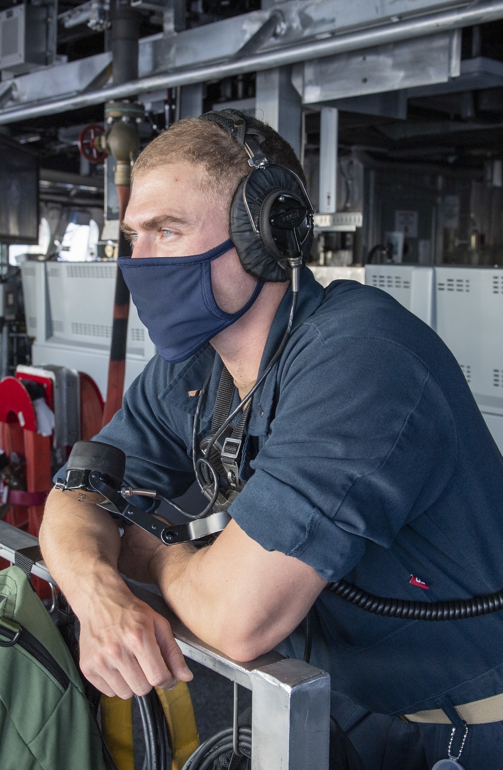 USS Jackson (LCS 6) Sailor stands watch on the bridge