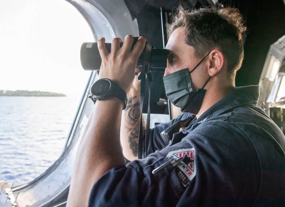 USS Jackson (LCS 6) Sailor stands watch on the bridge