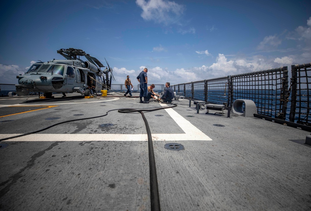 USS Billings and HSC 28 Sailors Operate a Pneumatic Pump