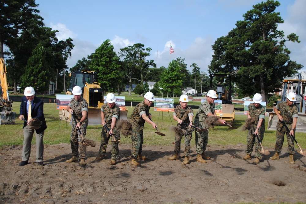 Cmdr. Landric Walden, executive officer for Officer in Charge of Construction Florence along with Marine Corps Air Station (MCAS) Cherry Point leaders break ground during the P-162 Headquarters Facility groundbreaking ceremony at MCAS Cherry Point