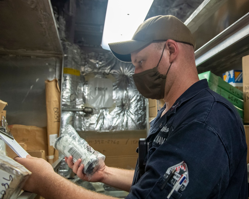USS Jackson (LCS 6) Sailor takes inventory