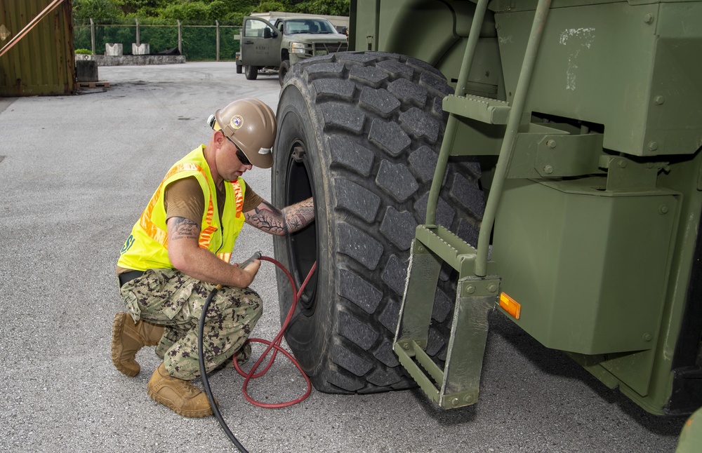 U.S. Army 835th Transportation Battalion and U.S. Navy Seabees with NMCB-5 transport civil engineer support equipment to Papua New Guinea