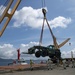 U.S. Army 835th Transportation Battalion and U.S. Navy Seabees with NMCB-5 transport civil engineer support equipment to Papau New Guinea