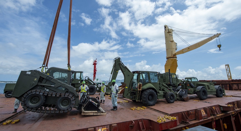 U.S. Army 835th Transportation Battalion and U.S. Navy Seabees with NMCB-5 transport civil engineer support equipment to Papua New Guinea