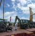 U.S. Army 835th Transportation Battalion and U.S. Navy Seabees with NMCB-5 transport civil engineer support equipment to Papua New Guinea