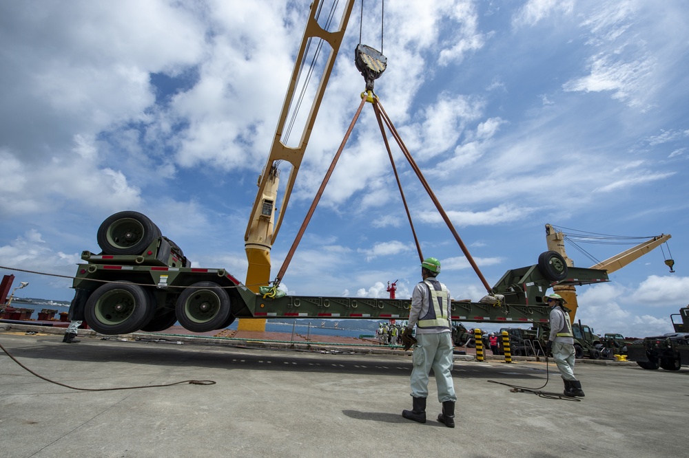 U.S. Army 835th Transportation Battalion and U.S. Navy Seabees with NMCB-5 transport civil engineer support equipment to Papua New Guinea