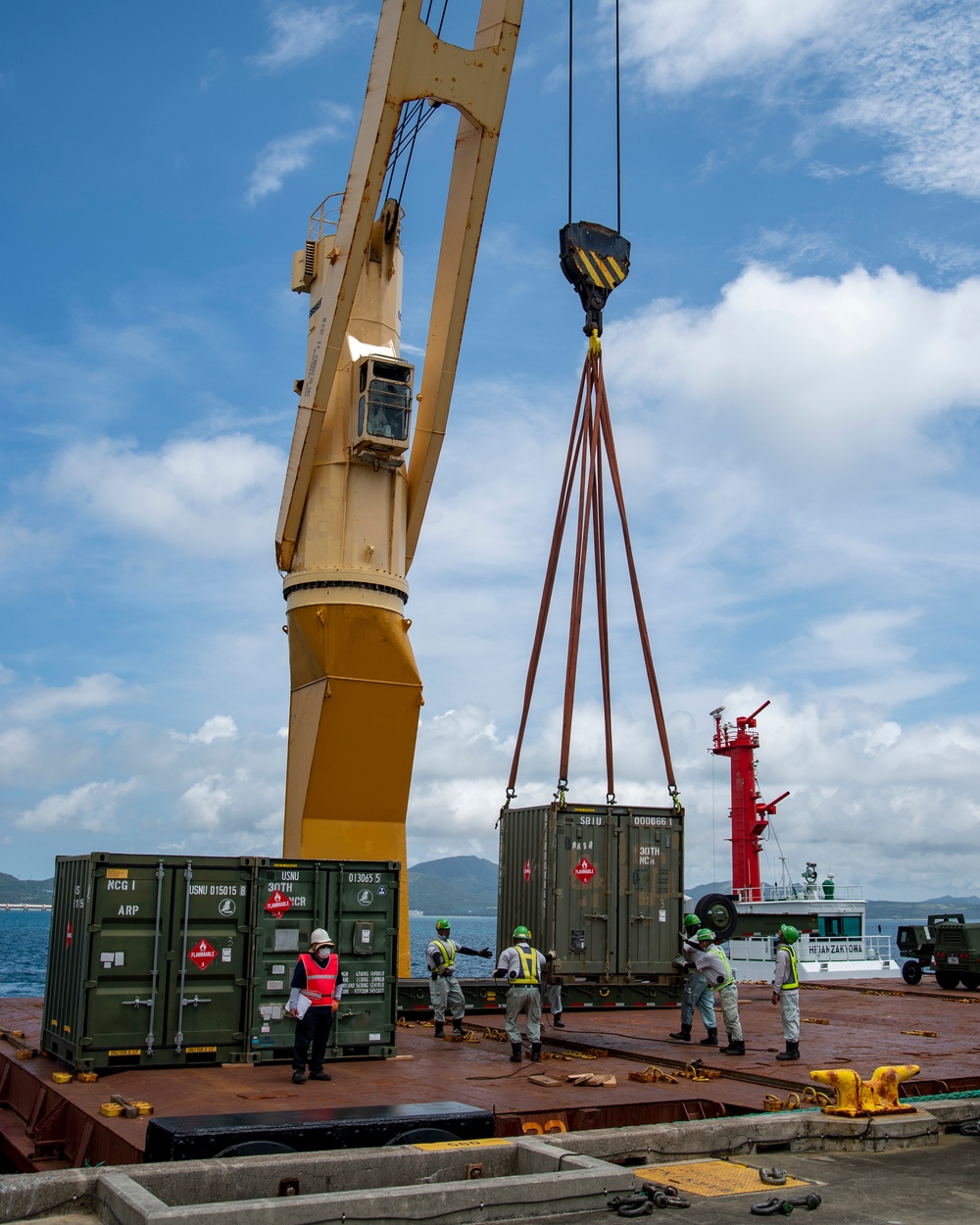 U.S. Army 835th Transportation Battalion and U.S. Navy Seabees with NMCB-5 transport civil engineer support equipment to Papua New Guinea