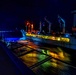 Arlington conducts a night time underway replenishment