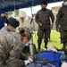 Guatemalan Military Nurses Prepare a Simulated Patient for Transport During Southern Partnership Station 2021