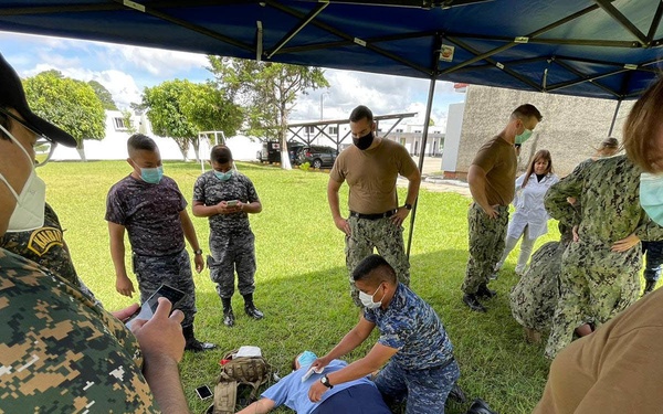 Guatemalan Military Members Demonstrate Surveying a Patient During Southern Partnership Station 2021