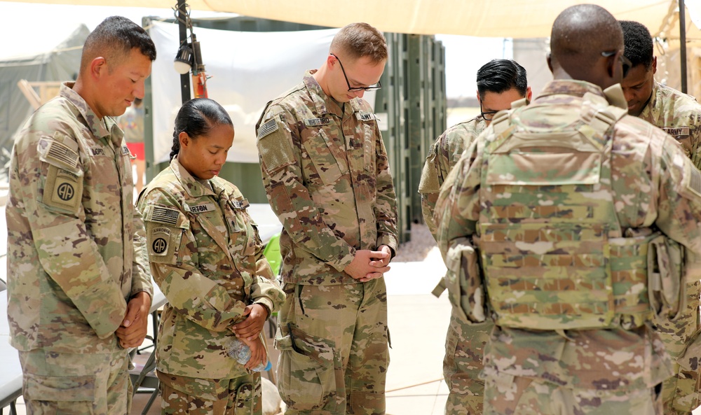 Task Force Phoenix Brigade Chaplain prays with Soldiers within Area of Operations