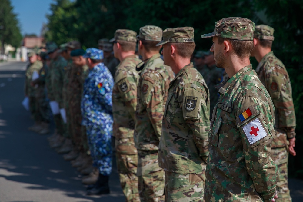 American and Romanian Reserve service members stand in formation
