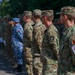 American and Romanian Reserve service members stand in formation