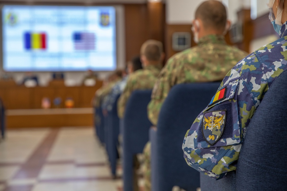 American and Romanian Reserve service members listen to a introduction brief