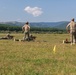 Army Reserve and Romanian Reserve service members fire an AK-47 rifle
