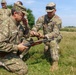 Staff Sgt. Devin Crawford shows a Romania Reserve Soldier rifle marksmanship techniques