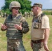 Sgt. Michael Yarrington talks with a Romanian range safety officer