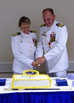 CAPT Hicks and CAPT Cole cut the cake during NCDOC's change of command reception
