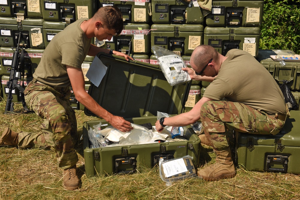 U.S. Army Spc. Eli Fox and Sgt. Stephen Sorleder Combat Medics Restock Medical Kits during Northern Strike 21-2