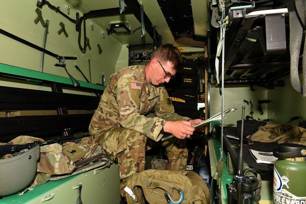 U.S. Army Combat Medic Pfc. Thomas Ray Leonard Studies the Ambulance Exchange Points during Northern Strike 21-2