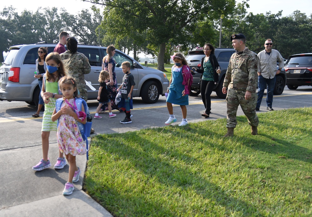 Defenders welcome kids on first day of school