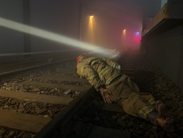 Search and Rescue teams train inside a subway simulator to extract notional victims