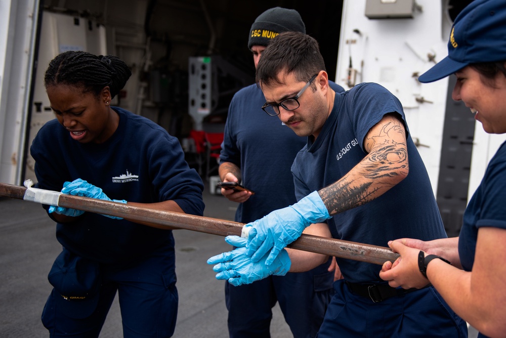 Members onboard the Coast Guard Cutter Munro participate in damage control training