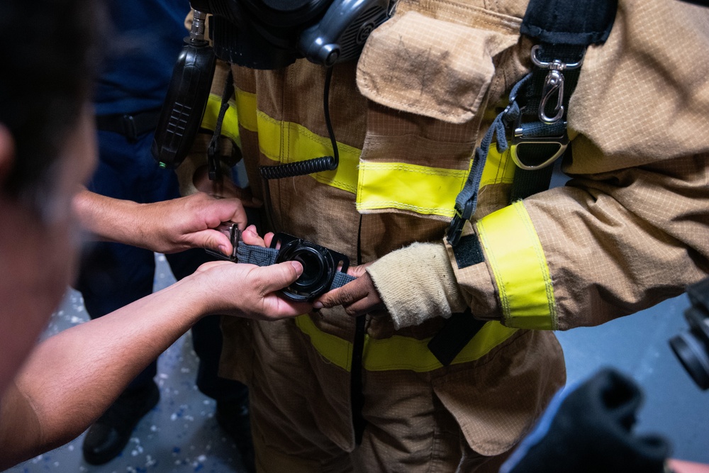 Members aboard Coast Guard Cutter Munro participate in damage control training