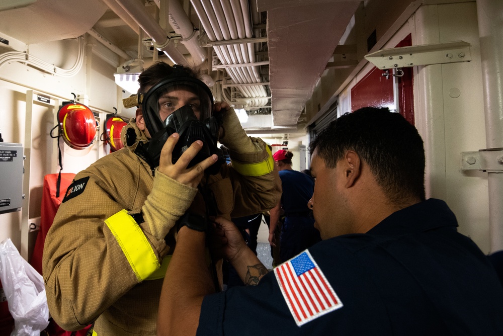 Members aboard Coast Guard Cutter Munro participate in damage control training